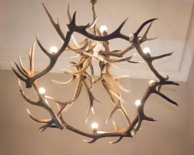 a chandelier with antlers hanging from a ceiling at Bridgend Hotel in Bridgend