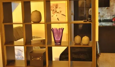 a book shelf with a vase in it at Finlaystone Barns in Port Glasgow