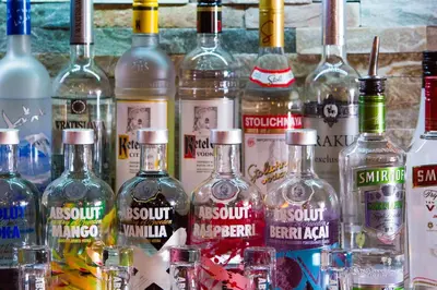 a bunch of bottles of alcohol on a table at Lamlash Bay Hotel in Lamlash