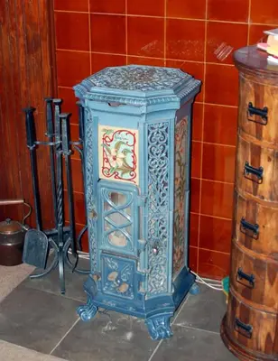 a blue cabinet sitting next to a wooden barrel at Dunivaig B&B in Tarbert