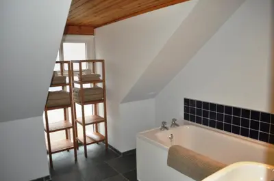 a bathroom with a sink and a bath tub at The Old Coach House, Alltshellach Cottages in North Ballachulish