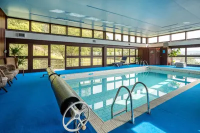 a large swimming pool with a cannon in the middle at Crispie House in Kilfinan