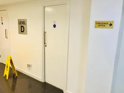 a elevator in a room with a sign on the wall at Glasgow Central Station SKYLINE Apartment with Parking (2 bedrooms, 2 bathrooms, 1 living room-Kitchen) in Glasgow