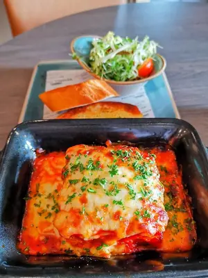 a tray with a dish of food with cheese and bread at Seamill House Hotel in Seamill