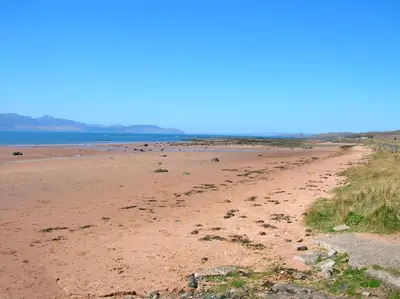 a sandy beach with the ocean in the background at Seamill House Hotel in Seamill