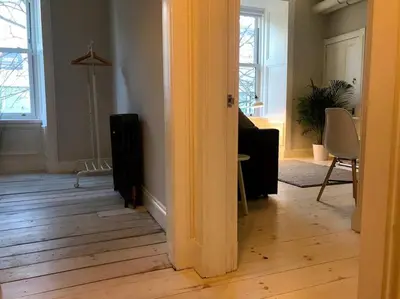 a living room with a hard wood floor at Relax In Style In Edinburghs Buzzing West End in Edinburgh