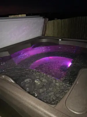 a purple jacuzzi tub with a purple top at Carriage Cottage Hot Tub in Beith