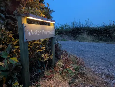 a sign for western minnesota with lights on it at Wester Muirhouse in Linlithgow