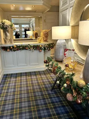 a living room with christmas decorations on the floor at Crookston Hotel in Glasgow