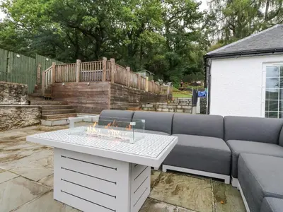 a couch and a table in a yard at Heatherbank in Garelochhead