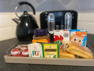 a tray with various food items on a counter at Central West End City Apartment in Glasgow