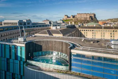 a building with a pool on the top of it at Sheraton Grand Hotel & Spa in Edinburgh