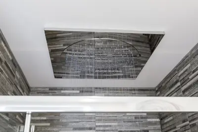 a ceiling in a room with a brick wall at The Torfin in Edinburgh