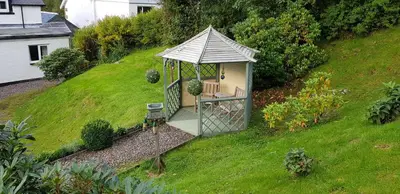 a gazebo on the side of a hill at Craigbank Guest House in Crianlarich
