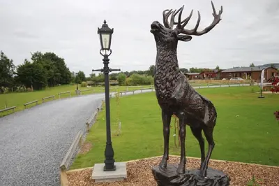 a statue of a deer next to a street light at Jackson Lodge in Perth
