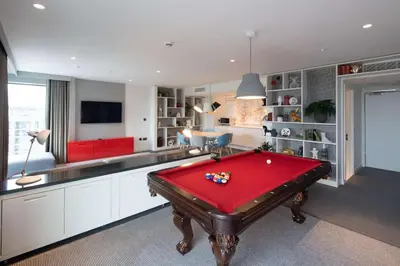 a room with a red pool table in it at Radisson RED Hotel, Glasgow in Glasgow