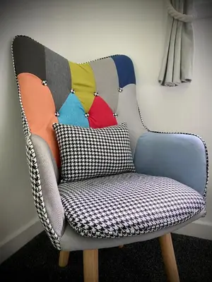 a chair with a pillow in a room at Barriemore Oban in Oban