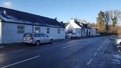 a car parked on the side of a street at Silver Ridge, 2 House O` Hill in Newton Stewart