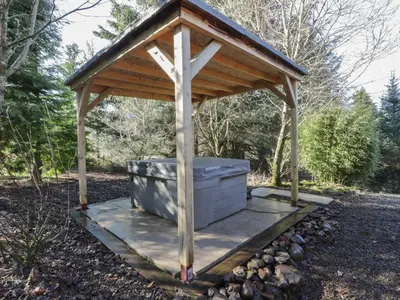 a wooden gazebo with a wooden roof at The Log Cabin in Kilmore