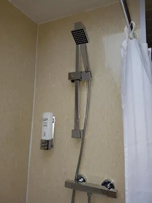 a shower in a bathroom with aaucet and a shower at Ardshiel Hotel in Campbeltown