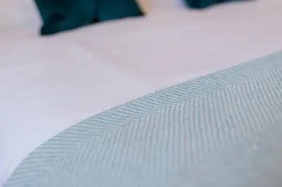a close up of a white mattress on a bed at Historic Edinburgh 1890s Home Turned Relaxing Retreat in Edinburgh
