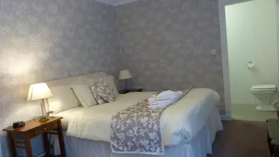 a bedroom with a bed with towels on it at The Lagg in Lagg