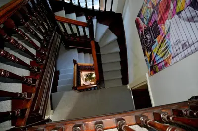 an overhead view of a spiral stairway with a plant in a mirror at Leirsinn Mhor in Killin