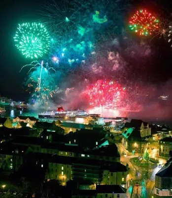 a city with fireworks in the sky at night at St Annes Guest House in Oban