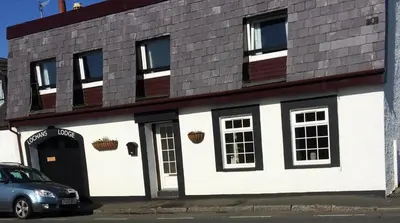a building with a car parked in front of it at Pottery Cottage, Lochans Lodge in Stranraer