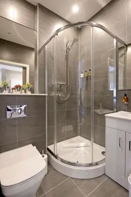 a bathroom with a shower and a toilet and a sink at Nelson Mandela Place Apartments in Glasgow