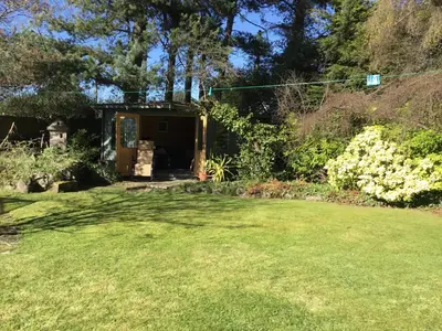 a garden with a shed in the background at Ingleneuk Bed and Breakfast in Edinburgh