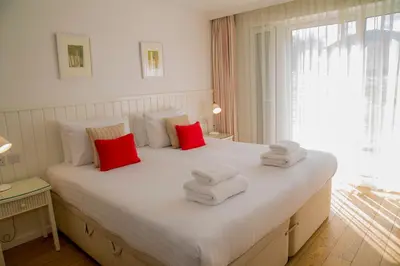 a bedroom with a large bed with towels on it at Bridge of Orchy Hotel in Bridge of Orchy