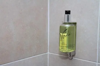 a soap dispenser is attached to a wall at Hill Park Hotel in Rosyth