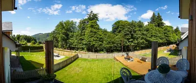 a view of a garden from a balcony at Taymore Lodge in Kenmore