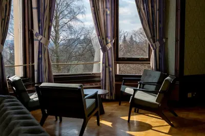 a room with chairs and a large window at Glasgow Youth Hostel in Glasgow