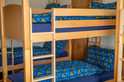a bunk bed with a chair in a bunk room at Glasgow Youth Hostel in Glasgow