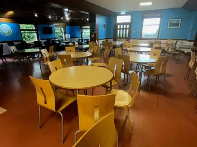 a dining room with tables and chairs in a building at Stirling Youth Hostel in Stirling