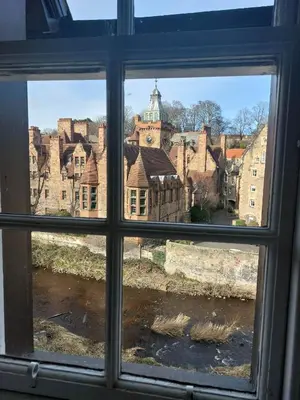 a view of a city through a window at Dean Village Cottage in Edinburgh