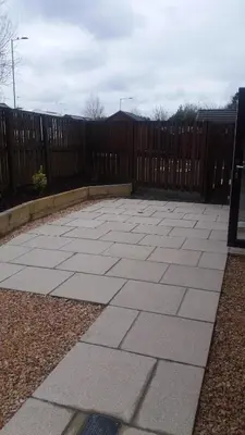 a patio in front of a wooden fence at Ritchie selfcatering in Callander