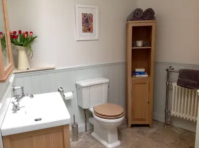 a bathroom with a toilet and a sink at JOIVY Stylish Apt in Trendy New Town Location in Edinburgh