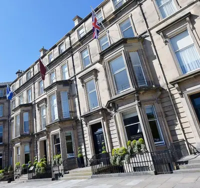 a large building with flags in front of it at The Bonham in Edinburgh