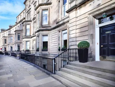 a building with a black door on a street at Hapimag Resort Edinburgh in Edinburgh