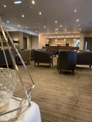a hotel lobby with chairs and a waiting room at Park Hotel in Falkirk