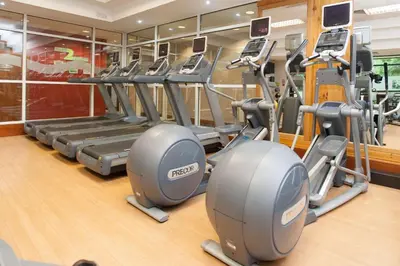 a gym with treadmills and elliptical machines at DoubleTree by Hilton Edinburgh Airport in Ingliston
