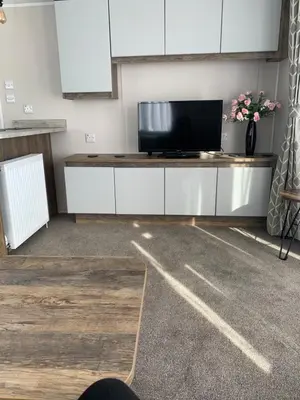 a room with a flat screen tv on a counter at Brookwood Sea View 14 in Dunoon