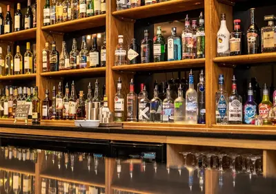 a bar filled with lots of bottles of alcohol at King Robert Hotel in Stirling