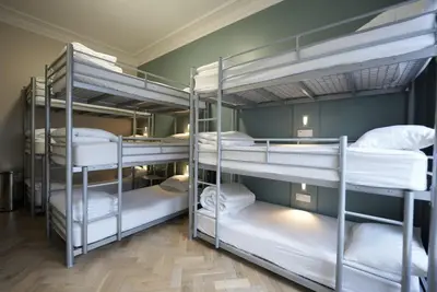 a group of bunk beds in a room at Revolver Edinburgh in Edinburgh