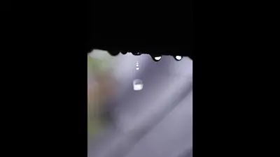 a close up of water droplets on a window at Aos Sí Lodges in Ballachulish