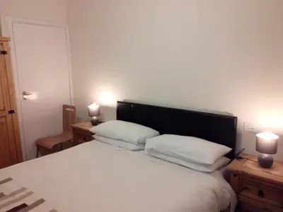 a bedroom with a bed with two white pillows at Homestay, Number 29, Dunollie in Oban