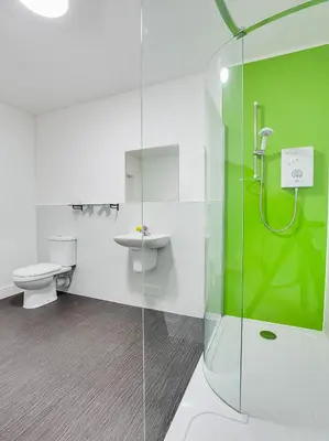 a bathroom with a shower and a toilet and a sink at Lost Guest House Stirling in Stirling
